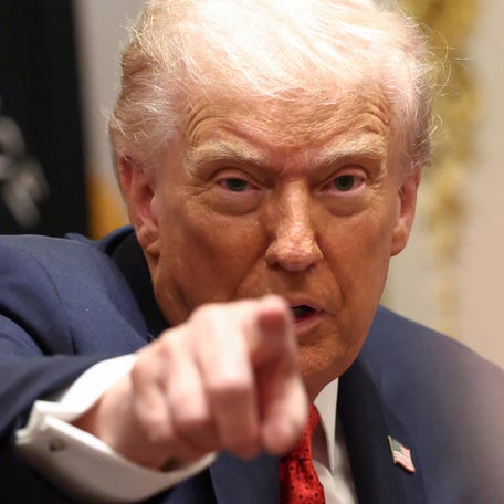 President Donald Trump gestures during a meeting with Australia's Prime Minister Anthony Albanese in the Cabinet Room at the White House, in Washington, D.C., U.S., October 20, 2025.