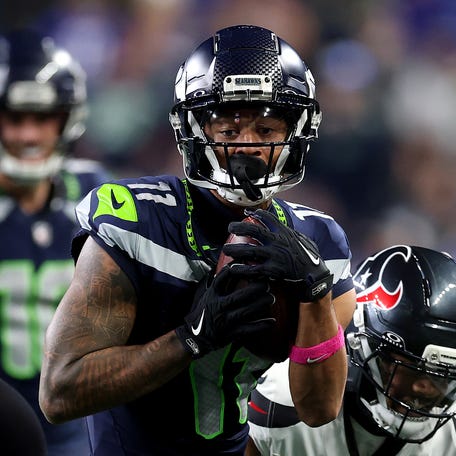 SEATTLE, WASHINGTON - OCTOBER 20: Jaxon Smith-Njigba #11 of the Seattle Seahawks runs the ball after a catch against Derek Stingley Jr. #24 of the Houston Texans during the second quarter at Lumen Field on October 20, 2025 in Seattle, Washington. (Photo by Steph Chambers/Getty Images)