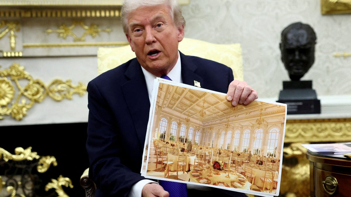 U.S. President Donald Trump holds an image of a rendering of the new White House ballroom to be built as he meets with Secretary General of the North Atlantic Treaty Organization (NATO) Mark Rutte (not pictured) in the Oval Office of the White House in Washington, D.C., U.S., October 22, 2025.