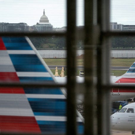 American Airlines flights stage on the tarmac at Reagan Washington National Airport as the U.S. government shutdown continues in Arlington, Virginia, U.S., October 8, 2025.