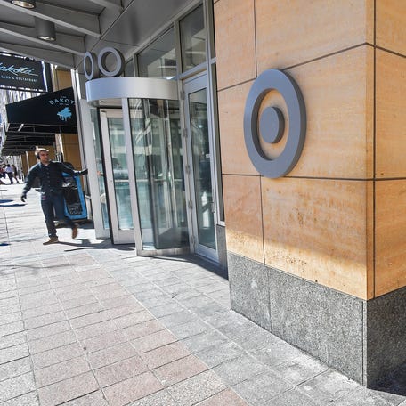 A pedestrian leaves Target headquarters in Minneapolis, Minnesota, March 10, 2015.