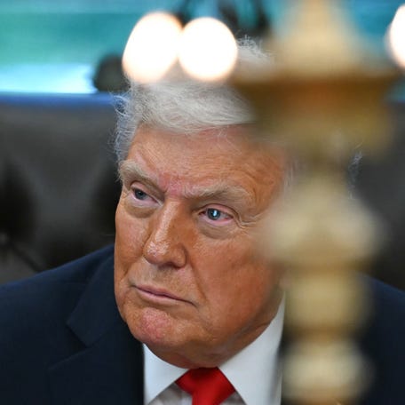 President Donald Trump participates in a Diwali celebration with American Indian leaders in the Oval Office of the White House in Washington, DC, on October 21, 2025.