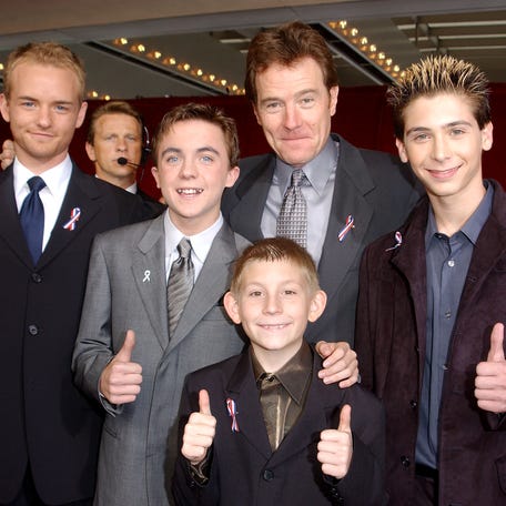 The cast of "Malcolm In The Middle" give a thumbs up sign at the Primetime Emmy Awards, Nov. 4, 2001, in Los Angeles. Actors from left: Christopher Masterson, Frankie Muniz, Erik Per Sullivan (front center), Bryan Cranston and Justin Berfield.