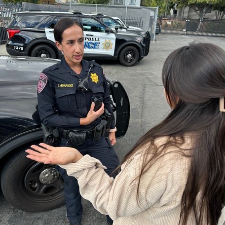 An officer with the Campbell Police Department uses an Axon body-worn camera equipped with live translation capabilities.
