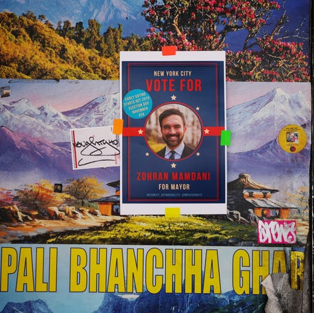 A campaign poster for New York City mayoral candidate Zohran Mamdani hangs in the borough of Queens on Oct. 8, 2025.