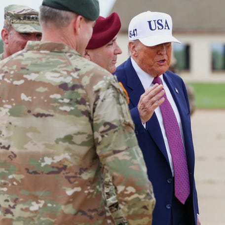 President Donald Trump speaks with Army members during a visit to Fort Bragg to mark the U.S. Army anniversary, in North Carolina, U.S., June 10, 2025.