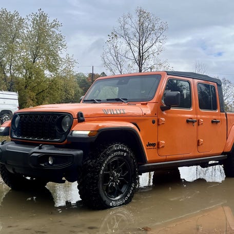 Jeep Gladiator parked in muddy water on October 22nd in Addison Township, Michigan