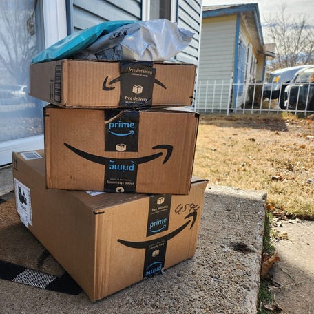 Amazon packages sit on the front porch of a home in Amarillo, Texas.