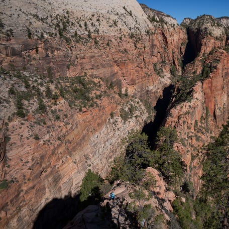 Visitors hike up Angel's Landing at Zion National Park during the government shutdown on October 6, 2025 in Springdale, Utah.