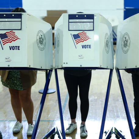 People take part in early voting at a polling center in the Manhattan borough of New York on Oct. 27, 2025.