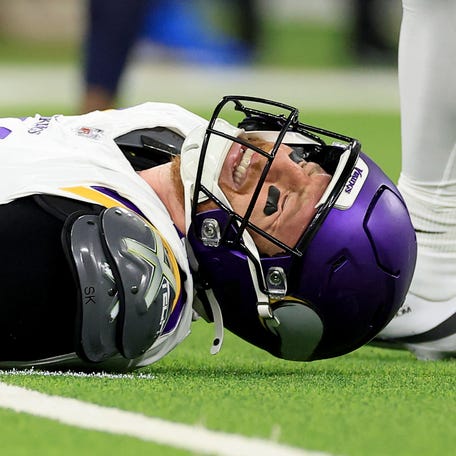 Carson Wentz #11 of the Minnesota Vikings reacts in pain on the ground after a play against the Los Angeles Chargers during the fourth quarter in the game at SoFi Stadium on October 23, 2025 in Inglewood, California.