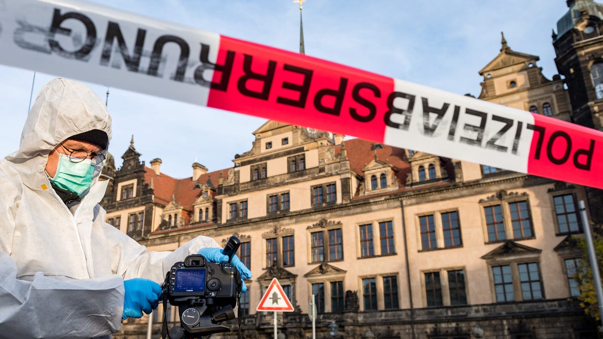 Criminal police investigate the environment outside the Residenzschloss palace that houses the Gruenes Gewoelbe (Green Vault) collection of treasures on Nov.25, 2019 in Dresden, Germany. Thieves, apparently after having sabotaged the electricity supply, broke into the museum through a window early this morning and reportedly made off with jewels, diamonds and other precious stones worth one billion Euros, making it the biggest heist in post-World War II German history.