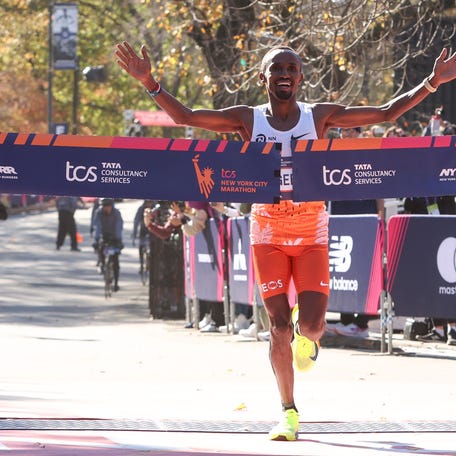 Abdi Nageeye of the Netherlands crosses the finish line on his way to winning the professional men's division of the New York City Marathon on Nov 3, 2024.