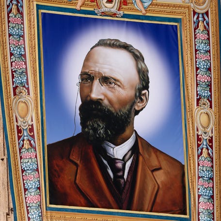 A portrait of Italian lawyer Bartolo Longo, a former Satanist turned Catholic, is displayed on the day of his canonization in St. Peter's Square at the Vatican on October 19, 2025.
