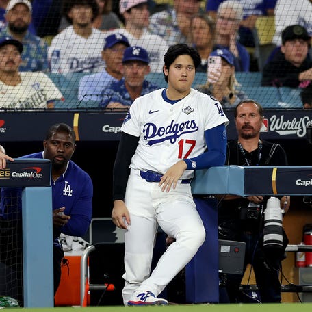 Shohei Ohtani looks on from the dugout during the ninth inning.