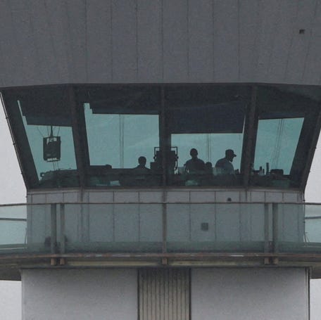 Air traffic controllers at Hollywood Burbank Airport's tower, which briefly closed due to staffing issues early in the shtudown. REUTERS/Daniel Cole/File Photo