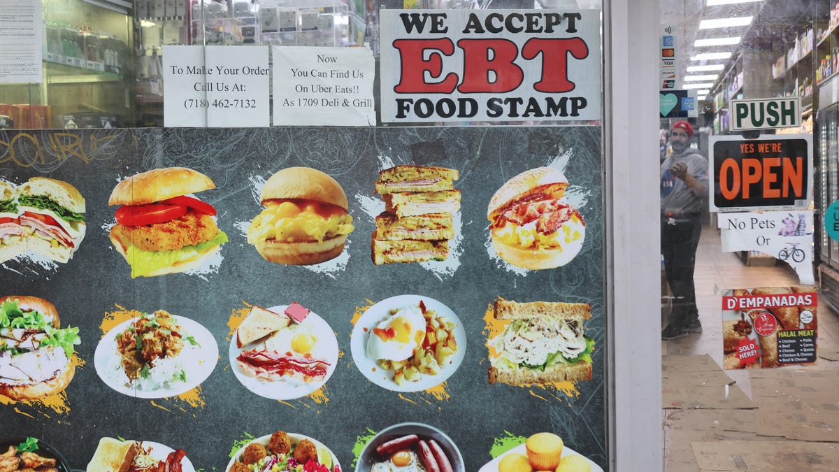 An EBT sign is displayed on the window of a grocery store on October 30, 2025 in the Flatbush neighborhood of the Brooklyn borough in New York City.