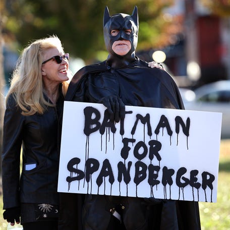A supporter of Virginia Democratic gubernatorial candidate, former Rep. Abigail Spanberger, dresses as Batman as he rallies outside of her campaign event at Ashland Town Hall Pavilion on October 31, 2025 in Ashland, Virginia. Spanberger will face off against Republican candidate Winsome Earle-Sears in the Commonwealth of Virginia's off-year election for governor and other statewide offices on November 4.