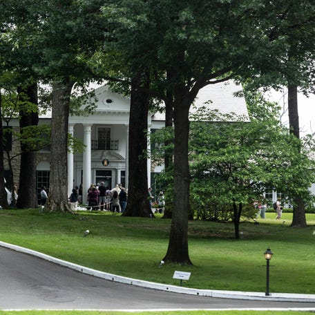 MEMPHIS, TENNESSEE - MAY 22: Tourists prepare to enter Graceland, the home of Elvis Presley, on May 22, 2024 in Memphis, Tennessee. Actress Riley Keough, granddaughter of Elvis Presley, is in a dispute with a company that claimed ownership of the mansion after saying his estate failed to repay a loan, Keough inherited Graceland and much of Presley's estate after her mother, Lisa Marie Presley, died last year. (Photo by Brad Vest/Getty Images)