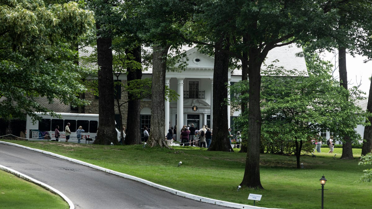 MEMPHIS, TENNESSEE - MAY 22: Tourists prepare to enter Graceland, the home of Elvis Presley, on May 22, 2024 in Memphis, Tennessee. Actress Riley Keough, granddaughter of Elvis Presley, is in a dispute with a company that claimed ownership of the mansion after saying his estate failed to repay a loan, Keough inherited Graceland and much of Presley's estate after her mother, Lisa Marie Presley, died last year. (Photo by Brad Vest/Getty Images)