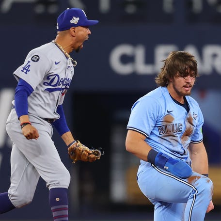 TORONTO, ONTARIO - OCTOBER 31: Mookie Betts #50 of the Los Angeles Dodgers celebrates after Addison Barger #47 of the Toronto Blue Jays is forced out at second base to end the game 3-1 in game six of the 2025 World Series at Rogers Center on October 31, 2025 in Toronto, Ontario. (Photo by Gregory Shamus/Getty Images)
