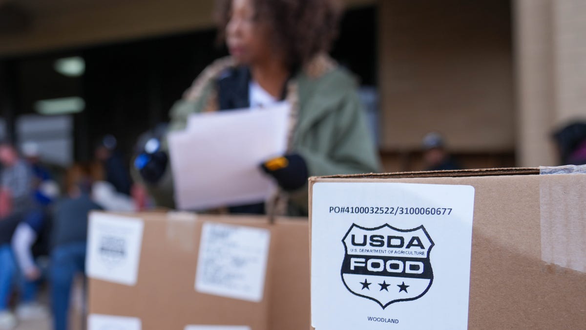 Volunteers distribute food at a Food Bank of the Rockies distribution site in Aurora, Colorado, on Nov. 1, 2025, following the halt of SNAP benefits for 42 million Americans.