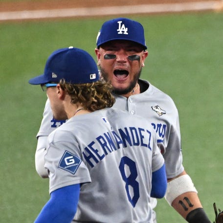Oct 31, 2025; Toronto, Ontario, CAN; Los Angeles Dodgers first baseman Enrique Hernandez (8) and second baseman Miguel Rojas (72) and shortstop Mookie Betts (50) celebrate after defeating the Toronto Blue Jays in game six of the 2025 MLB World Series at Rogers Centre. Mandatory Credit: Dan Hamilton-Imagn Images