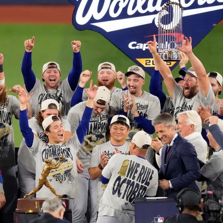 The Los Angeles Dodgers celebrate after defeating the Toronto Blue Jays in Game 7 for their second consecutive World Series title.