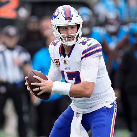 Oct 26, 2025; Charlotte, North Carolina, USA; Buffalo Bills quarterback Josh Allen (17) drops to throw during the first half against the Carolina Panthers at Bank of America Stadium.