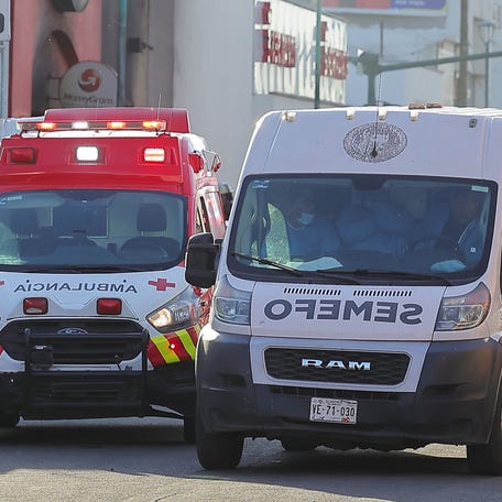 Forensic technicians work in the area where a fire inside a store killed multiple people, in Hermosillo, Mexico, November 1, 2025.