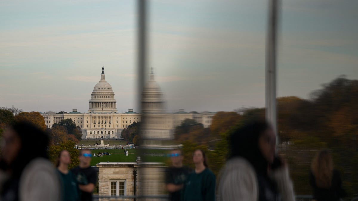 People visit the Washington Monument, more than a month into the continuing U.S. government shutdown in Washington, D.C., Nov. 2, 2025.