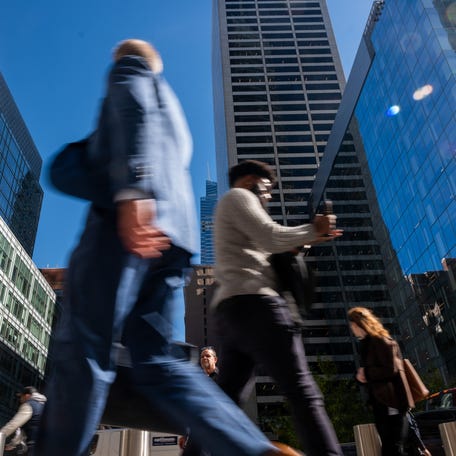 NEW YORK, NEW YORK - OCTOBER 16: Crowds walk through midtown Manhattan on October 16, 2025 in New York City. While many analysts predicted that New York City would never recover from the pandemic work-at-home shift, the city has pulled most workers back to its office towers. In Manhattan, office vacancy fell this year to around 16%, the lowest since 2019, and to near zero in some buildings. (Photo by Spencer Platt/Getty Images)