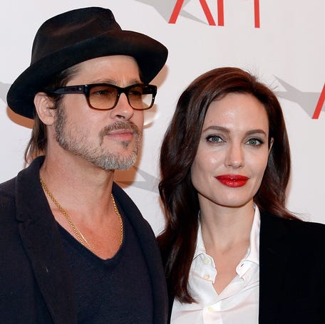 Brad Pitt and Angelina Jolie pose at the AFI Awards 2014 in Beverly Hills, California, on Jan. 9, 2015.