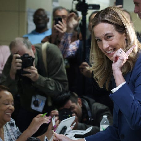 U.S. Representative Mikie Sherrill and Democratic nominee for New Jersey governor checks in with election volunteers as she arrives to vote on Election Day in Montclair, New Jersey, U.S., November 4, 2025.