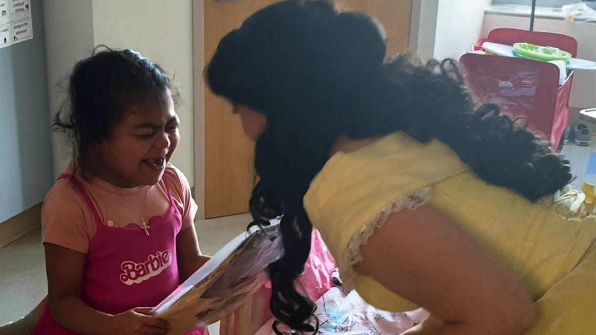 The Princess Program Foundation makes a little girl's day when Belle and Ariel surprise her while in the Boston Children's Hospital.