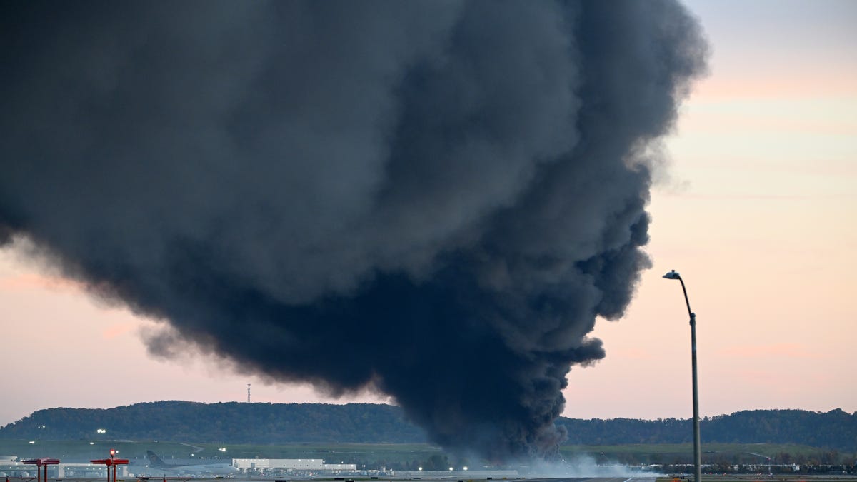 Fire and smoke are visible after a UPS cargo plane crashed near Louisville Muhammad Ali International Airport on Nov. 4, 2025, in Louisville, Kentucky.