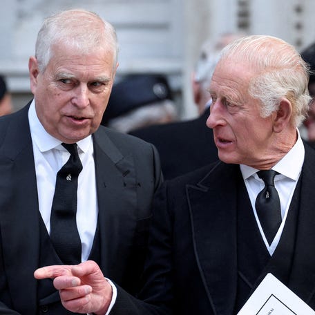 Prince Andrew speaks with King Charles as they leave Westminster Cathedral at the end of the Requiem Mass on the day of the Duchess Katharine's funeral in London on Sept. 16, 2025.