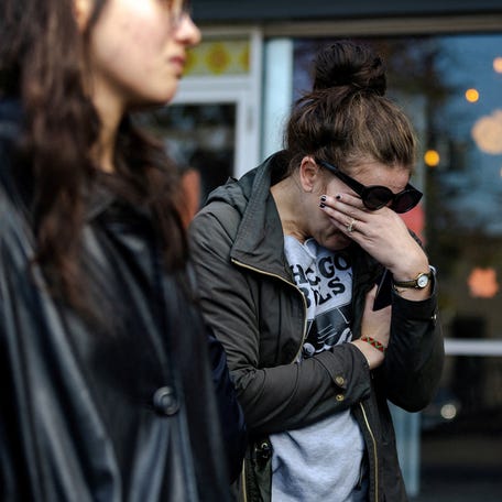 A parent cries outside of the Rayito De Sol Spanish Immersion Daycare and Pre-School, where federal agents conducted an immigration raid that ended in a teacher being detained, in Chicago, Ill. on Nov. 5, 2025.