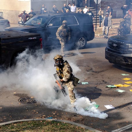 Federal agents using tear gas during clashes in Chicago on Oct. 14, 2025.