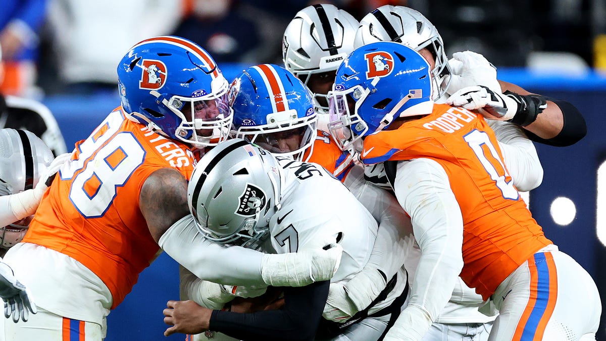 DENVER, COLORADO - NOVEMBER 06: John Franklin-Myers #98 of the Denver Broncos sacks Geno Smith #7 of the Las Vegas Raiders during the second quarter in the game at Empower Field At Mile High on November 06, 2025 in Denver, Colorado. (Photo by Jamie Schwaberow/Getty Images)