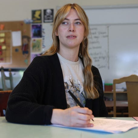 School teacher Kelly Elizabeth Belt fills out paperwork to payback her student loan while trying to navigate policies under the current administration of U.S. President Donald Trump, in Provo, Utah, U.S. May 30, 2025. REUTERS/Jim Urquhart