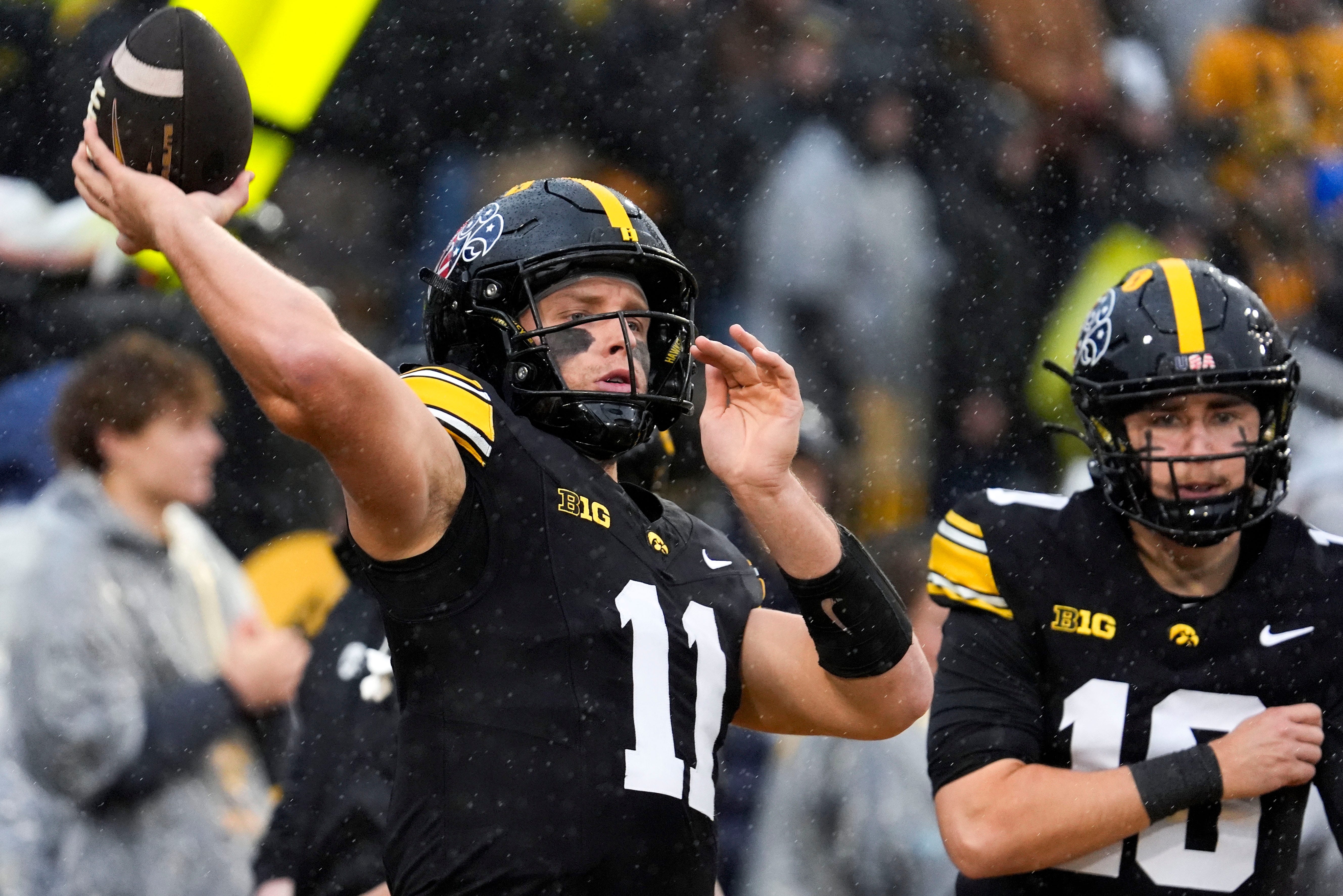 Iowa Hawkeyes quarterback Mark Gronowski (11) warms up Nov. 8, 2025 before a Big Ten Football game against the Oregon Ducks at Kinnick Stadium in Iowa City, Iowa.