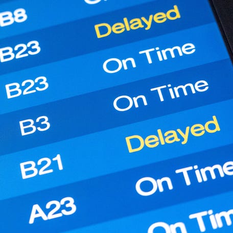 A departures screen shows outgoing flights Friday, Nov. 7, 2025, at Indianapolis International Airport.