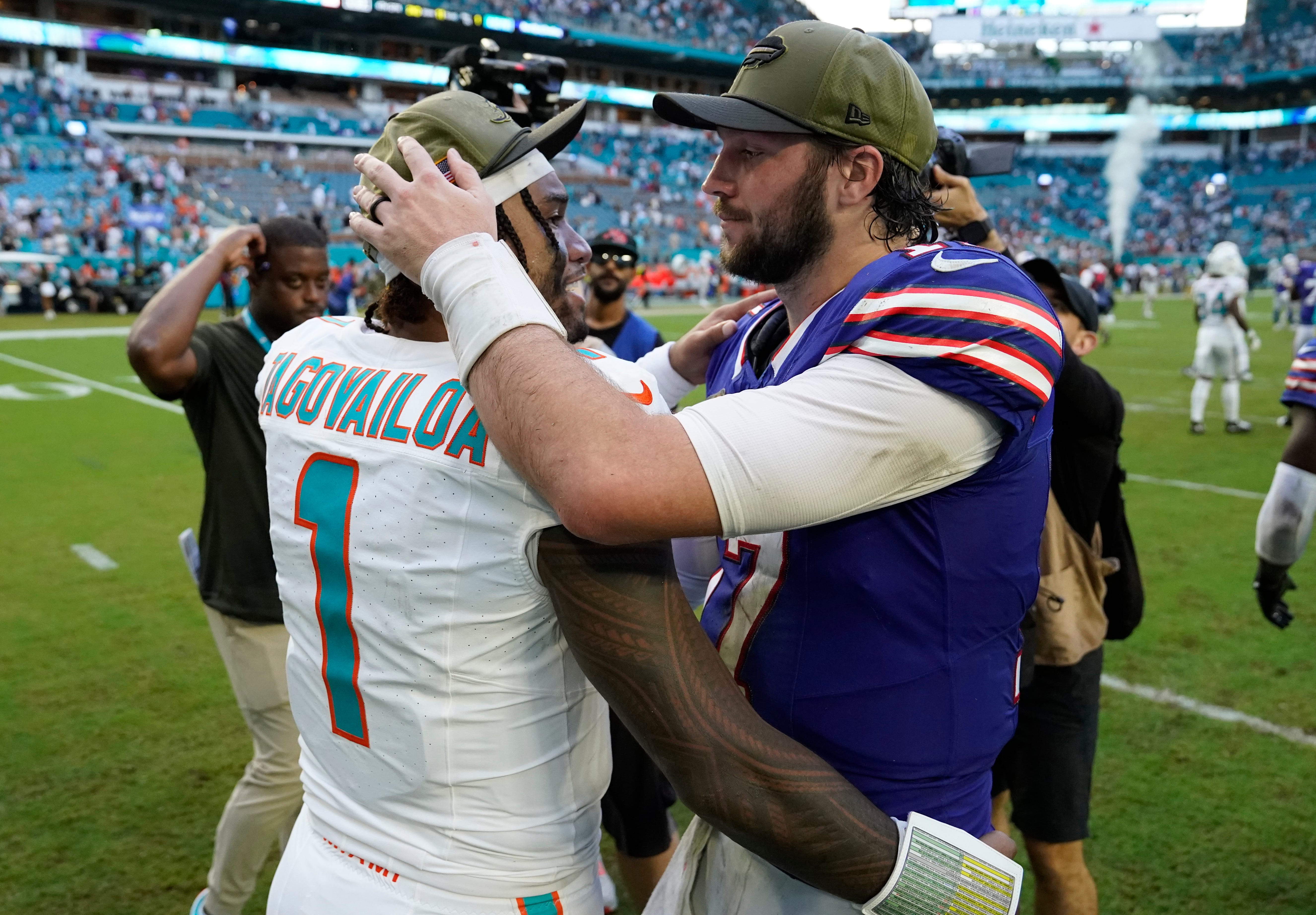 Nov 9, 2025; Miami Gardens, Florida, USA; Miami Dolphins quarterback Tua Tagovailoa (1) talks to Buffalo Bills quarterback Josh Allen (17) after defeating the Bills at Hard Rock Stadium. Mandatory Credit: Jeff Romance-Imagn Images