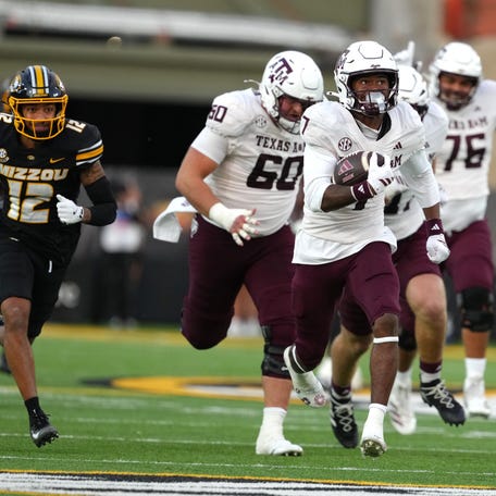 COLUMBIA, MISSOURI - NOVEMBER 08: KC Concepcion #7 of the Texas A&M Aggies runs for a touchdown against the Missouri Tigers in the second half at Faurot Field at Memorial Stadium on November 08, 2025 in Columbia, Missouri. (Photo by Ed Zurga/Getty Images)