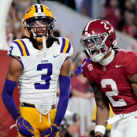 Nov 8, 2025; Tuscaloosa, Alabama, USA; Alabama wide receiver Ryan Williams (2) celebrates his touchdown catch in front of LSU defensive back DJ Pickett (3) at Saban Field at Bryant-Denny Stadium. Mandatory Credit: Gary Cosby Jr.-Imagn Images