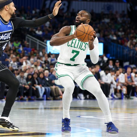 Boston Celtics guard Jaylen Brown (7) is guarded by Orlando Magic guard Jalen Suggs (4) at Kia Center on Nov. 7, 2025. Nathan Ray Seebeck-Imagn Images