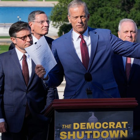 Senate Majority Leader John Thune, R-South Dakota, with House Speaker Mike Johnson, R-Louisiana, to his right, and other congressional Republican leaders hold a news conference on the first day of the federal government shutdown on Oct. 1, 2025.