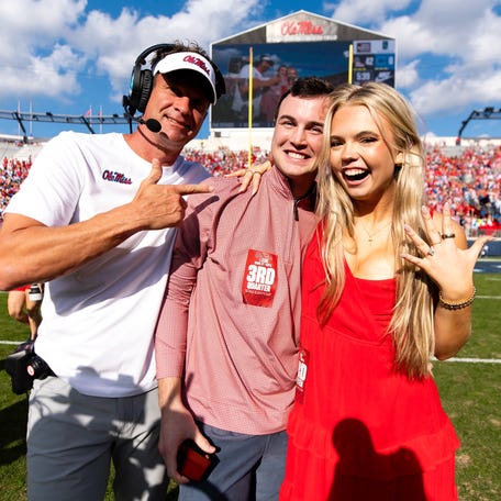 Drew O'Connor and Madison Barnette got engaged on the field during the Mississippi football game against The Citadel at Vaught-Hemingway Stadium in Oxford on Nov. 8, 2025. Ole Miss coach Lane Kiffin joined for one of the celebratory photos.