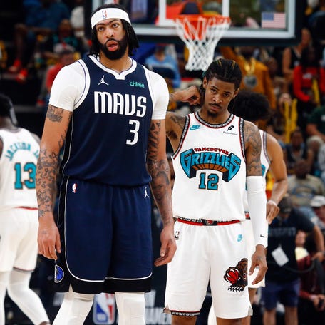 Dallas Mavericks forward Anthony Davis (3) and Memphis Grizzlies guard Ja Morant (12) look on during the third quarter at FedExForum on April 18, 2025. Petre Thomas-Imagn Images